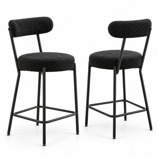 Deux sièges de bar noirs bouclés à dossier arrondi sur fond blanc.